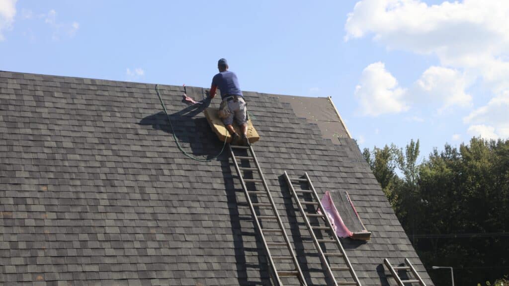 A homeowner hired a roofing company near me to replace the shingles on their roof.