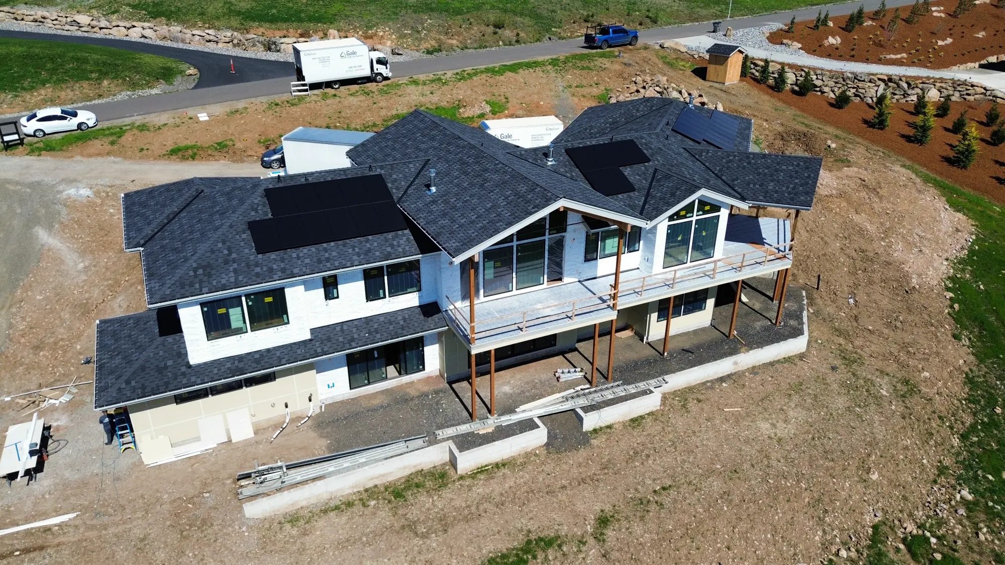 Alfred’s Roofing installing asphalt shingles on a modern home in Vancouver, WA.