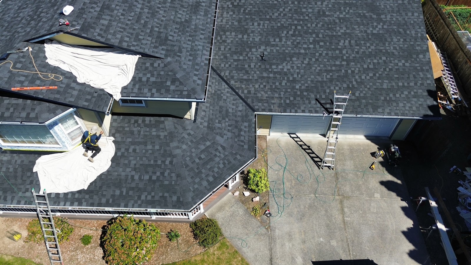 Aerial view of a residential roof with architectural asphalt shingles from IKO, installed by Alfred’s Roofing