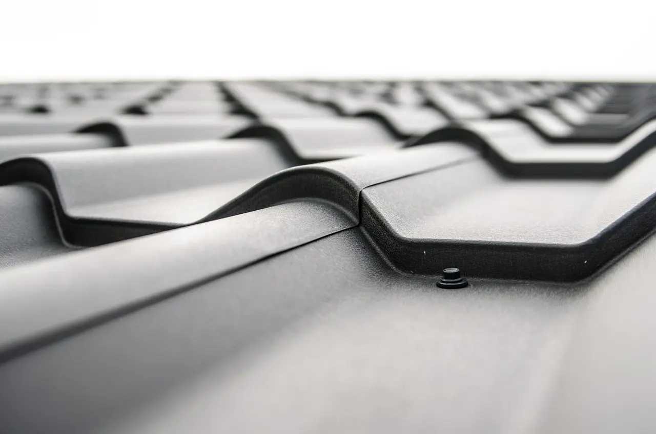 Up-close image of expert metal roofing installation in Washington state. 