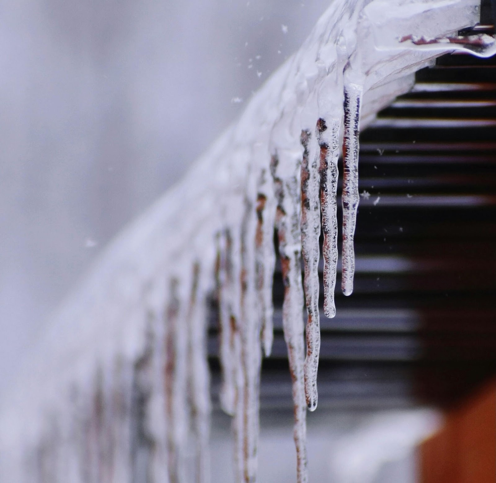 Ice-covered residential roof, showing winter roof replacement conditions in WA.