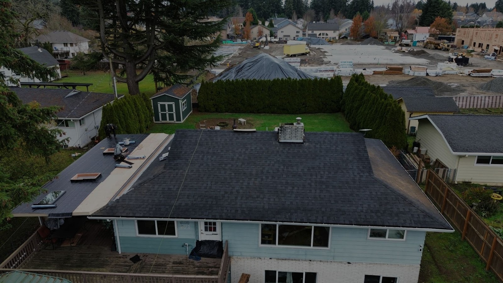 Residential roof being evaluated during winter conditions