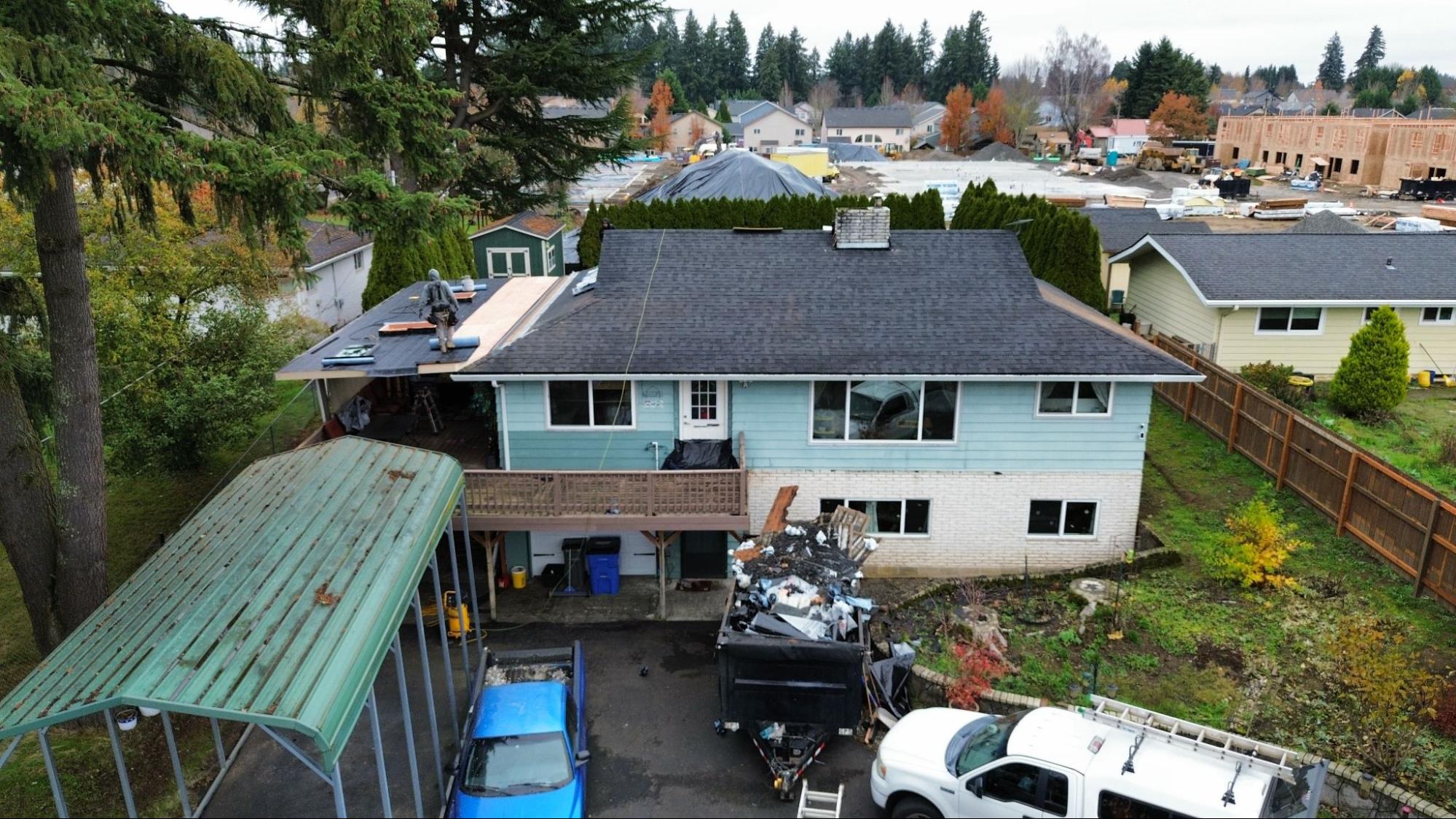 Alfred's Roofing crew wrapping up the roof replacement process on a Southwest Washington home.