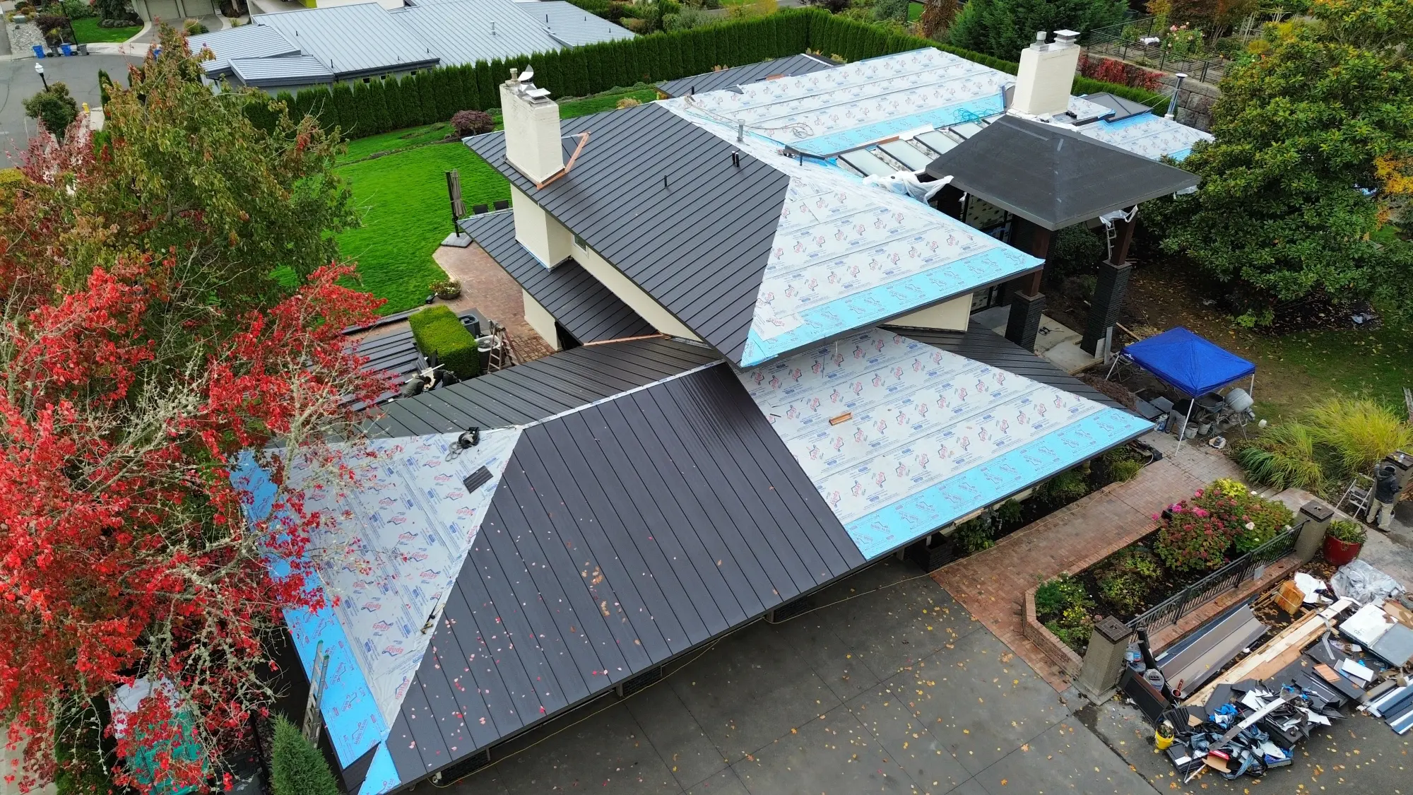 Aerial view of a metal roof installation underway on a Kelso residential home. 