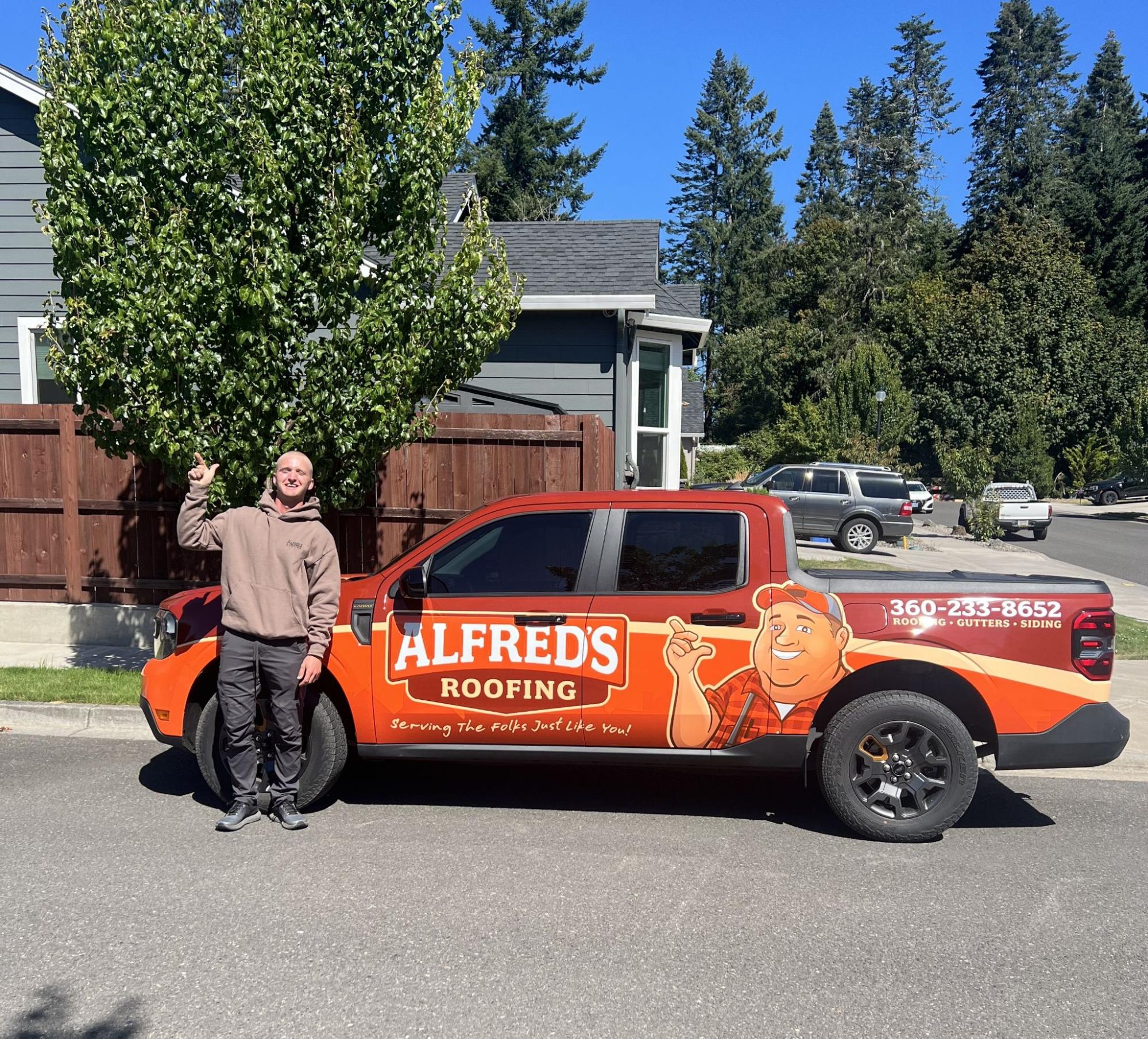 Alfred's Roofing branded truck on-site at a Southwest Washington home, ready for a roof inspection.