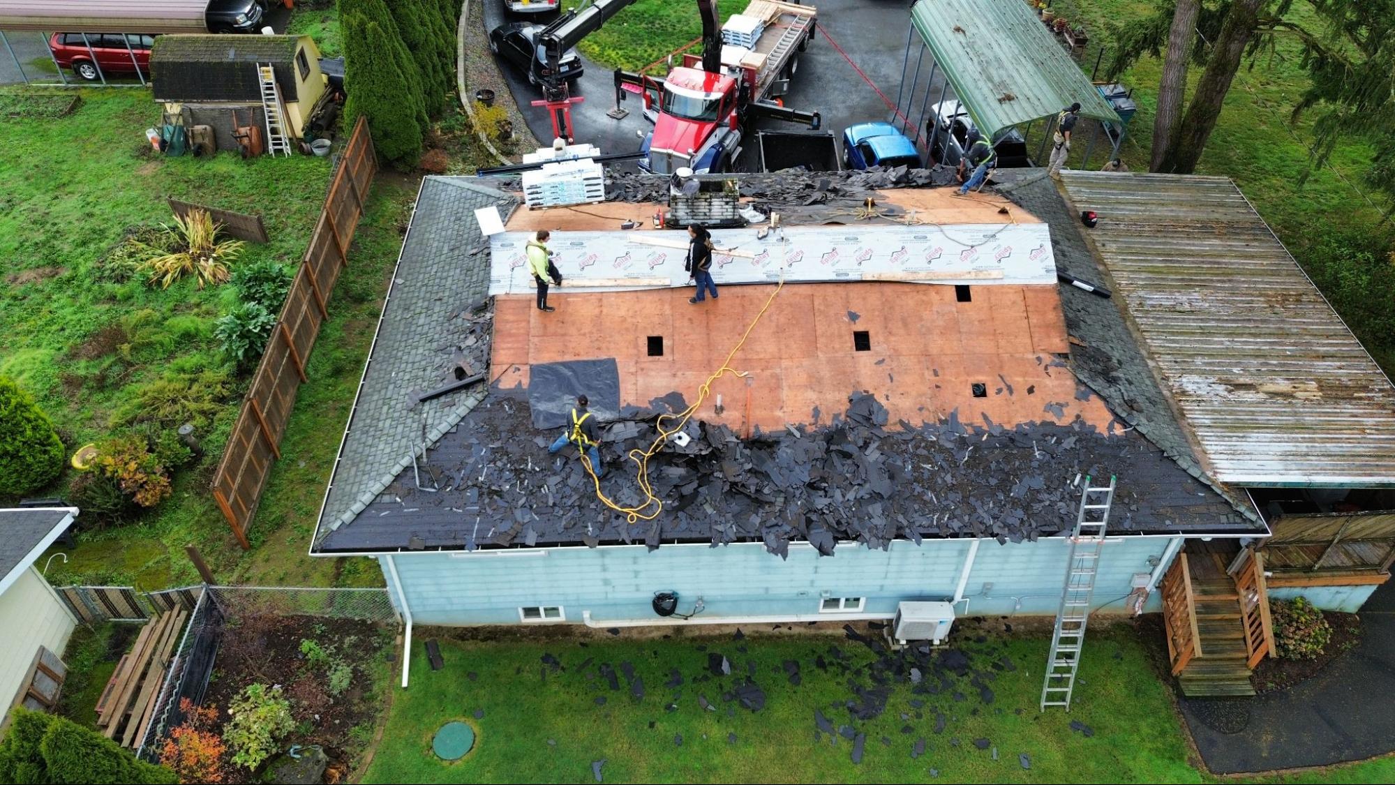 Alfred's Roofing crew mid-tear-off during a Vancouver, WA roof replacement. 