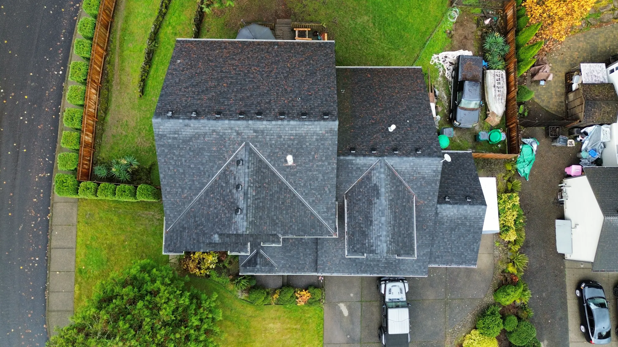 Aerial view of an asphalt shingle roof in need of inspection and repair in Southwest Washington
