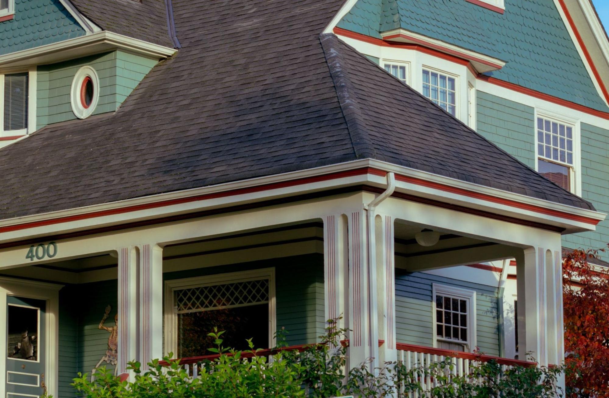 Finished gutter installation on a classic Vancouver, WA home, with clean white gutters and a downspout.