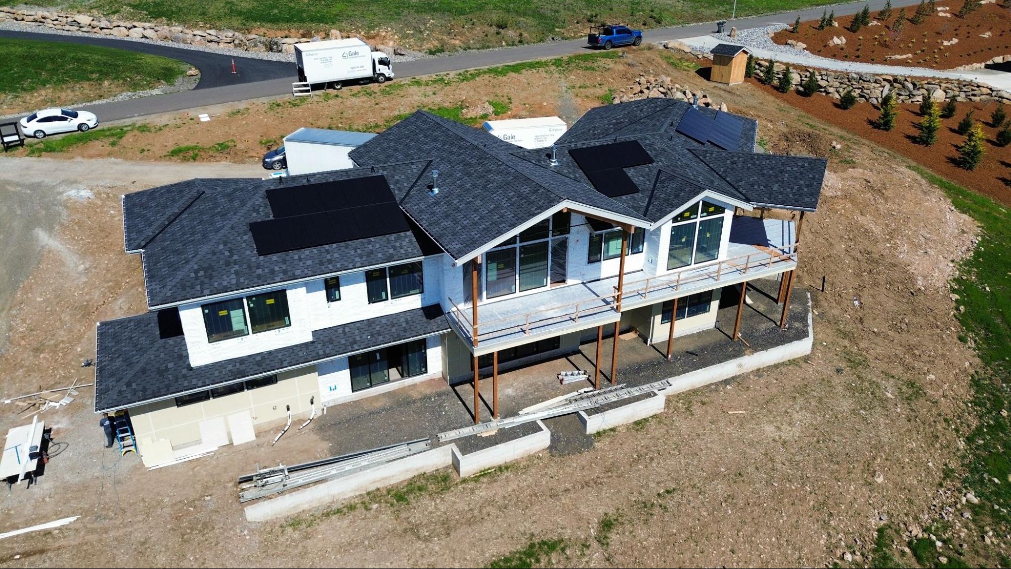 Aerial view of a new asphalt shingle roof installed on a Vancouver, WA home