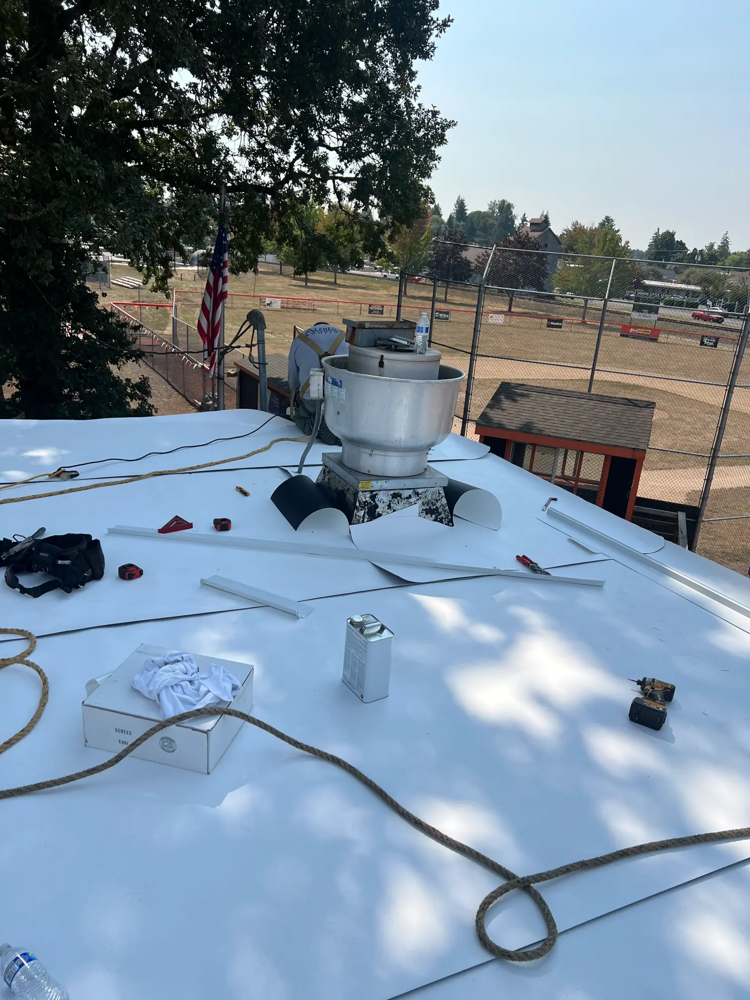 Heat-welded TPO membrane and rooftop flashing on a low-slope roof in Vancouver, WA
