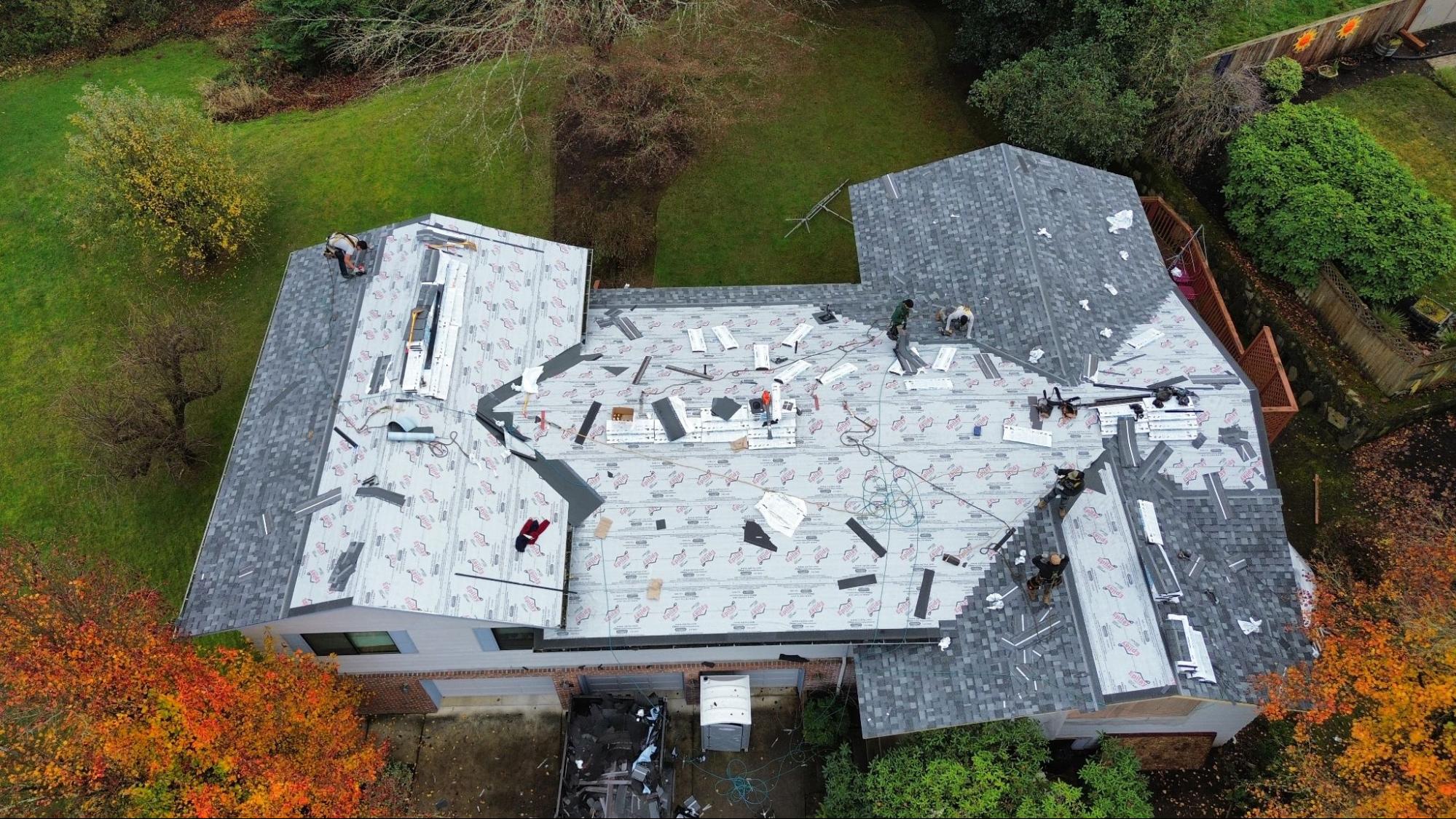 Aerial view of Alfred's Roofing crew replacing a Vancouver, WA roof in fall